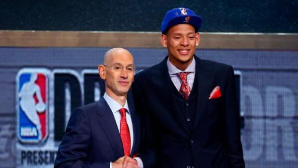 The inspiring tale of basketball player Isaiah Austin –his blinding right eye injury, Marfan syndrome, and victory over his physical disabilities! Source: ABC News (Isaiah Austin with Adam Silver)