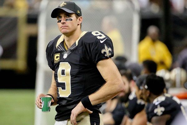 The football quarterback,Drew Brees celebrates after breaking NFL