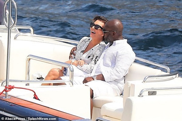 Kris Jenner and Corey Gamble cozy up on a boat en route their yacht in Mona...