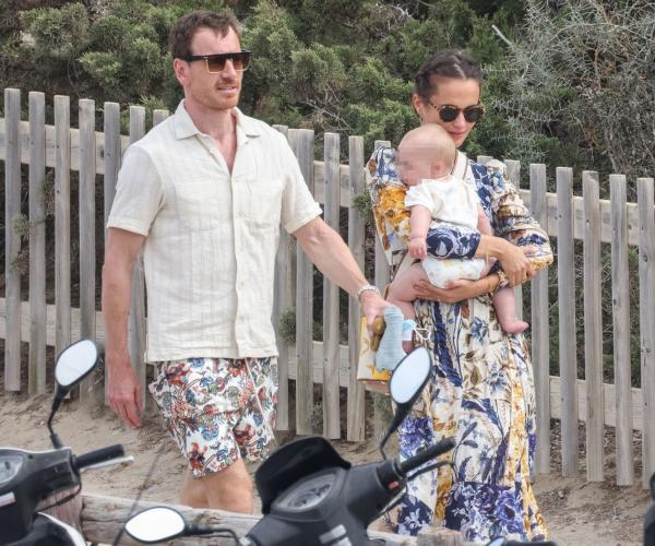 Alicia Vikander and husband Michael Fassbender are seen pushing a baby in a  stroller